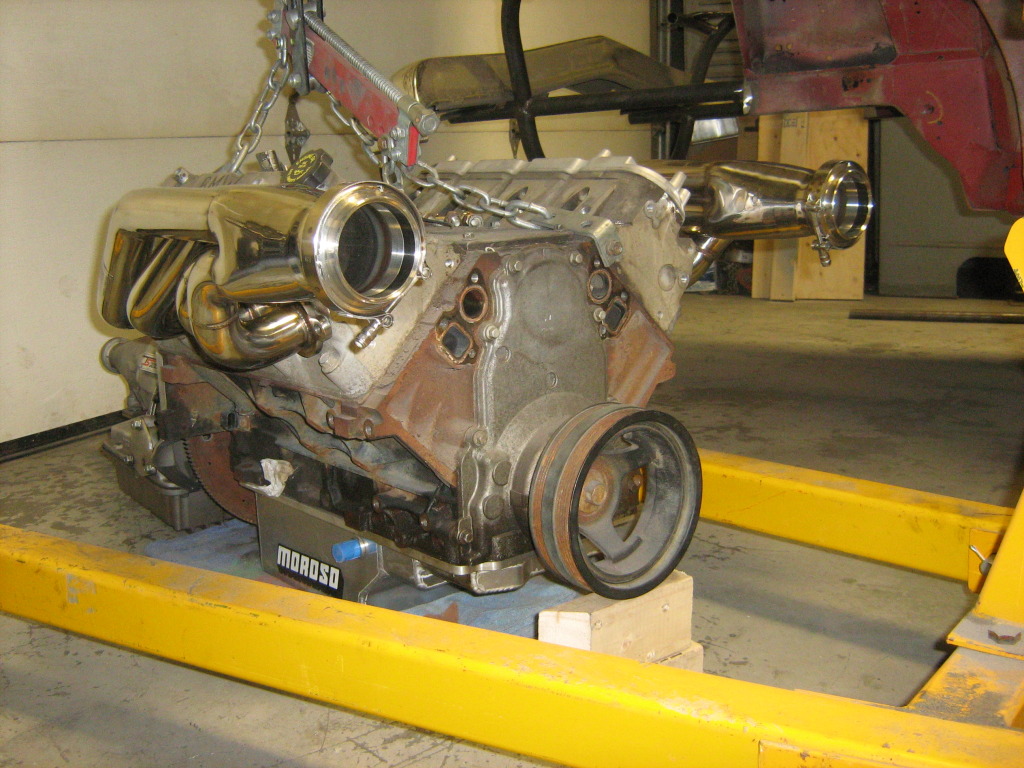 Engine with headers