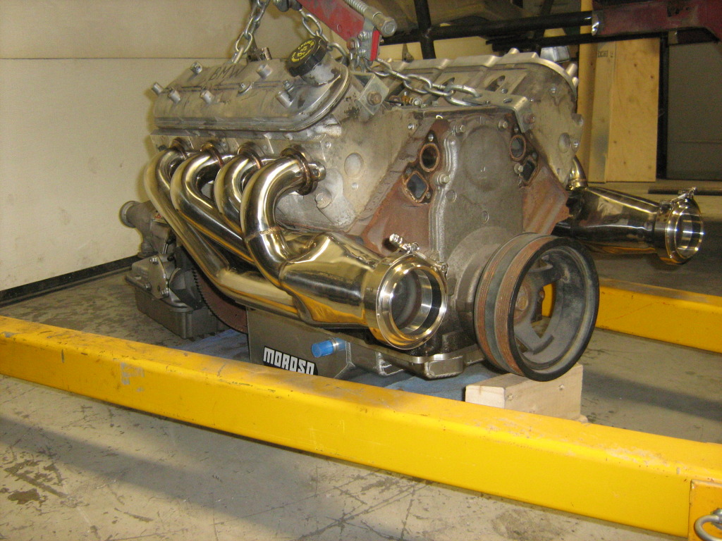 Engine with headers