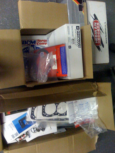 Rocker arms, head gaskets, head bolts, intake bolts, intake gaskets, valve covers gaskets, timing cover, timing gasket, aluminum water pump pulley, water neck / gaskets, thermostat, distributor, base clamp and gasket for dist, ACCEL wires (red), valve cover breather, air breather, oil pan, dip stick, bolts for pan and timing cover, headman shorty headers, B&M 2,500 stall, TCI tranny rebuild kit and push rod length checker